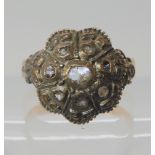 A yellow and white metal flower shaped ring set with rose cut diamonds, size Q, weight 6.1gms