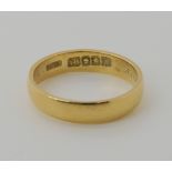 An 18ct gold Glasgow hallmarked wedding ring dated 1909, weight 5.9gms Condition Report: Available