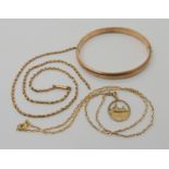A 9ct gold bangle, a 9ct gold chain with Canberra ship pendant and a yellow metal chain (af)