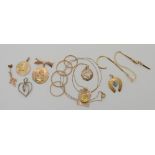 A collection of 9ct and yellow metal pendants, chains etc, to include a diamond set heart pendant