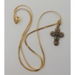 A 14k chain length 40.5cm, with a yellow metal diamond and sapphire cross, weight combined 4.8gms