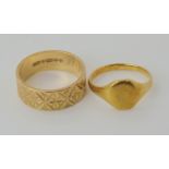 An 18ct gold signet ring dated London 1929, size K, weight 2.7gms, and a retro 1970's wide
