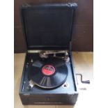 A Cliftophone portable gramophone featuring The Cliftophone Amplifier (patent) and a record