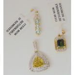 An 18ct gold tourmaline and diamond pendant, an 18ct gold spalerite and diamond pendant and a