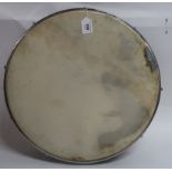 A bodhran drum in green wood and inscribed N L to the crossbar Condition Report: Available upon