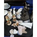 A lot comprising a selection of Nao & Lladro figures, Hummel figures, a resin figure of a golfer &