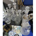 A lot comprising a selection of cut glass and crystal decanters, including an example by Forster