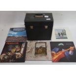 A box of vinyl LP records with Pink Floyd and band member solo releases, Marillion, Dire Straits,