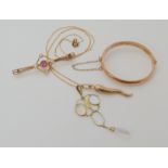 A 9ct gold baby's bangle inner diameter 3.7cm, a 9ct chain with two 9ct pendants and a brooch,