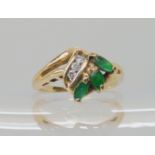 A 9ct emerald and diamond ring size J1/2, weight 2.6gms Condition Report: Available upon request