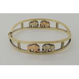 A 9ct gold elephant design bangle. Inner diameter approx 6.1cm x 5cm, weight 14.3gms Condition