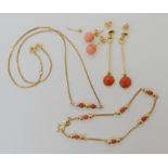 A pair of 18k gold coral drop earrings, length 4.4cm, weight 3.4gms. Similar style coral necklet and