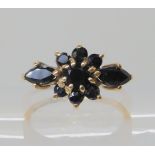 A 9ct gold sapphire flower ring, size L1/2, weight 1.9gms Condition Report: Available upon request