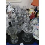 A lot comprising a quantity of cut glass and crystal drinking glasses, a selection of decanters