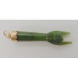 A New Zealand green hardstone pendant carved as a hand symbol, as a protective amulet mounted in