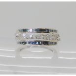 A 9ct white gold princess cut blue diamonds and white opaque diamonds, size L1/2, weight 3.4gms