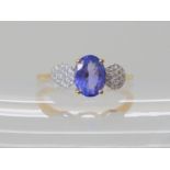 A 9ct gold tanzanite and clear gem set ring size N1/2, weight 2gms Condition Report: Available