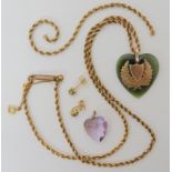 A vintage yellow metal chain with attached New Zealand jade heart pendant, an amethyst heart pendant