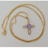 A 9ct gold Glen Lehrer amethyst and diamond set cross and chain length 51cm, weight 3.5gms (signed