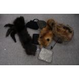 A lot comprising a fox stole, another brown fur stole, ladies evening bags including a finely beaded