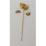 A gold nugget tie pin together with two loose gold nuggets, weight combined 10.6gms Condition