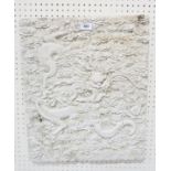 A cast plaster panel depicting a dragon among clouds chasing a flaming pearl, 52 x 44 cm The