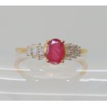 A 9ct gold ruby and baguette cut diamond ring, size V1/2, weight 2gms Condition Report: Available