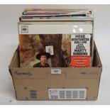 A box of vinyl LP records with Marty Robins, Belafonte, Flanders and Swan, The Corries, Richard