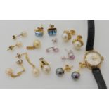 A collection of gold and yellow metal gem set earrings, and a 9ct gold ladies Swiss Empress watch