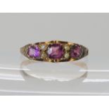 A 12ct gold garnet and pearl ring hallmarked Birmingham 1869, size Q, weight 1.4gms Condition