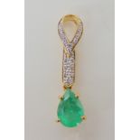 An 18ct gold emerald and diamond pendant, length 2.8cm, weight 2.6gms with a certificate from