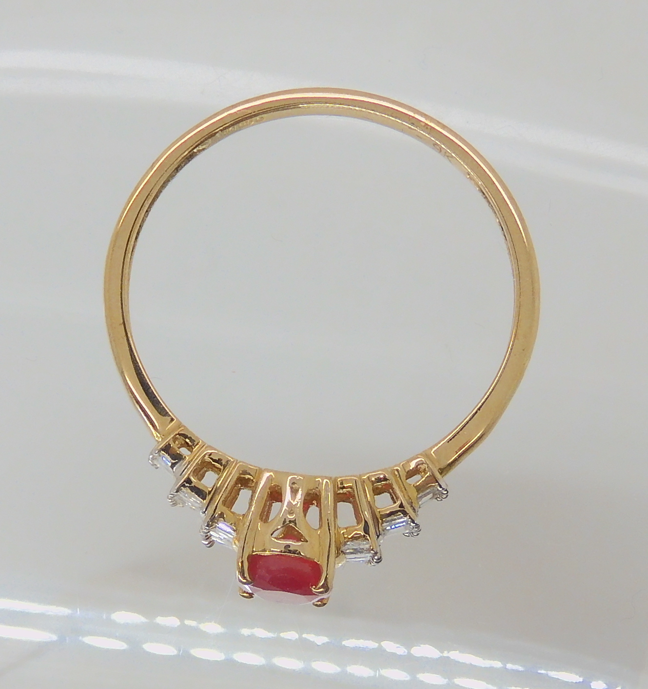 A 9ct gold ruby and baguette cut diamond ring, size V1/2, weight 2gms Condition Report: Available - Image 2 of 3