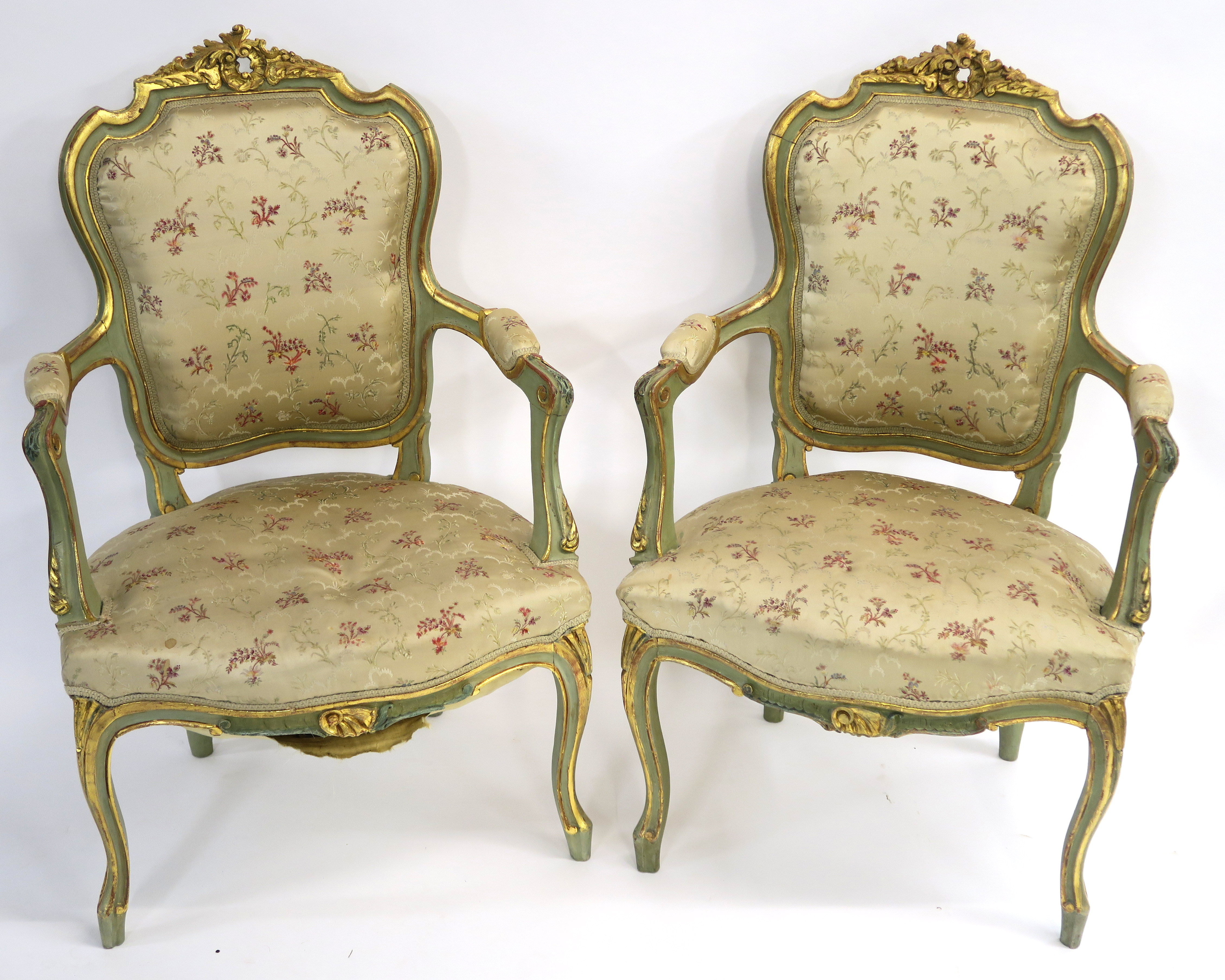 A PAIR OF LOUIS XV STYLE GILTWOOD AND PAINTED FAUTEUIL with carved foliate cresting and padded