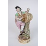 A MEISSEN FIGURE OF A MAN modelled standing beside a barrel, 17cm high Condition Report: missing