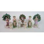 THREE 19TH CENTURY SAMSON PORCELAIN CHELSEA DERBY FIGURES each standing in front of a bocage,