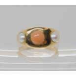 A CORAL AND PEARL RING the shank is stamped '18' and the inner shank is engraved ER 1888, the