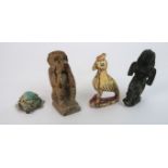 EGYPTIAN ARTIFACTS An ivory carving of a bird, 6cm high, bronze sphinx figure ,7cm high, stone