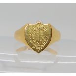 A BRIGHT YELLOW METAL SHIELD SHAPED SIGNET RING with monogram engraved to the front with