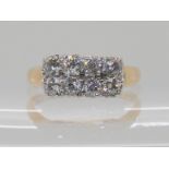 A DIAMOND PANEL RING set with eight old cut diamonds with an estimated combined total of 0.96cts,
