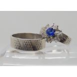 A RETRO RING SET comprising of a 18ct white gold sapphire and 'diamond accent' cluster ring, with
