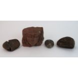 A SANDSTONE CARVED HEAD the female head decorated with moon and stars crown, 16cm high, Medieval