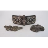 AN OTTOMAN WHITE METAL AND NIELLO BELT BUCKLE decorated with scrolling foliate medallions and key