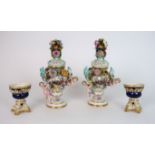A PAIR OF MEISSEN STYLE FLORAL ENCRUSTED VASES AND COVERS each with painted scenes of courting