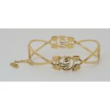 A 9CT GOLD MACKINTOSH STYLE ROSE BANGLE inner dimensions 6cm x 5cm weight 17gms Condition Report: