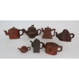 A GROUP OF YIXING TEAPOTS in various shapes and sizes, 6cm to 13cm high (7)