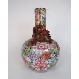 A CANTON MILLIEFIORI BALUSTER VASE painted all over with flowers and applied with a dragon chasing