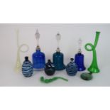 A COLLECTION OF NAILSEA GLASS including a green glass bell, two blue glass bells, three flasks