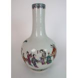 A CHINESE BALUSTER VASE painted with ladies at leisure in a walled garden, beneath a ruji band and