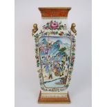 A CANTON SQUARE PANELLED BALUSTER VASE painted with processions of figures in mountainous