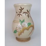 A CLARICE CLIFF POTTERY VASE the cream ground painted with flowers and foliage with scallop edge